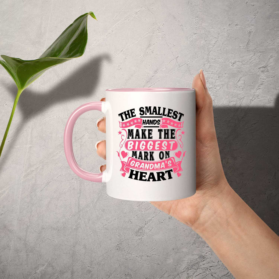 The Smallest Hands Make The Biggest Mark On Grandma's Heart - 11oz Accent Mug Pink